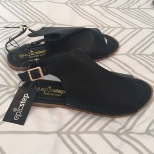 Black peep toe sandals with strap.